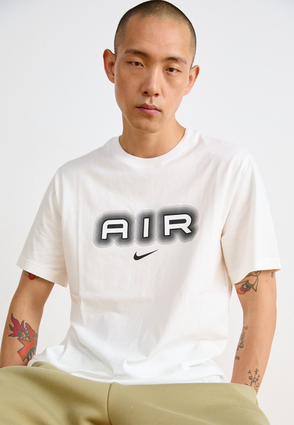 

Футболки с принтом AIR GRAPHIC TEE Nike, белый