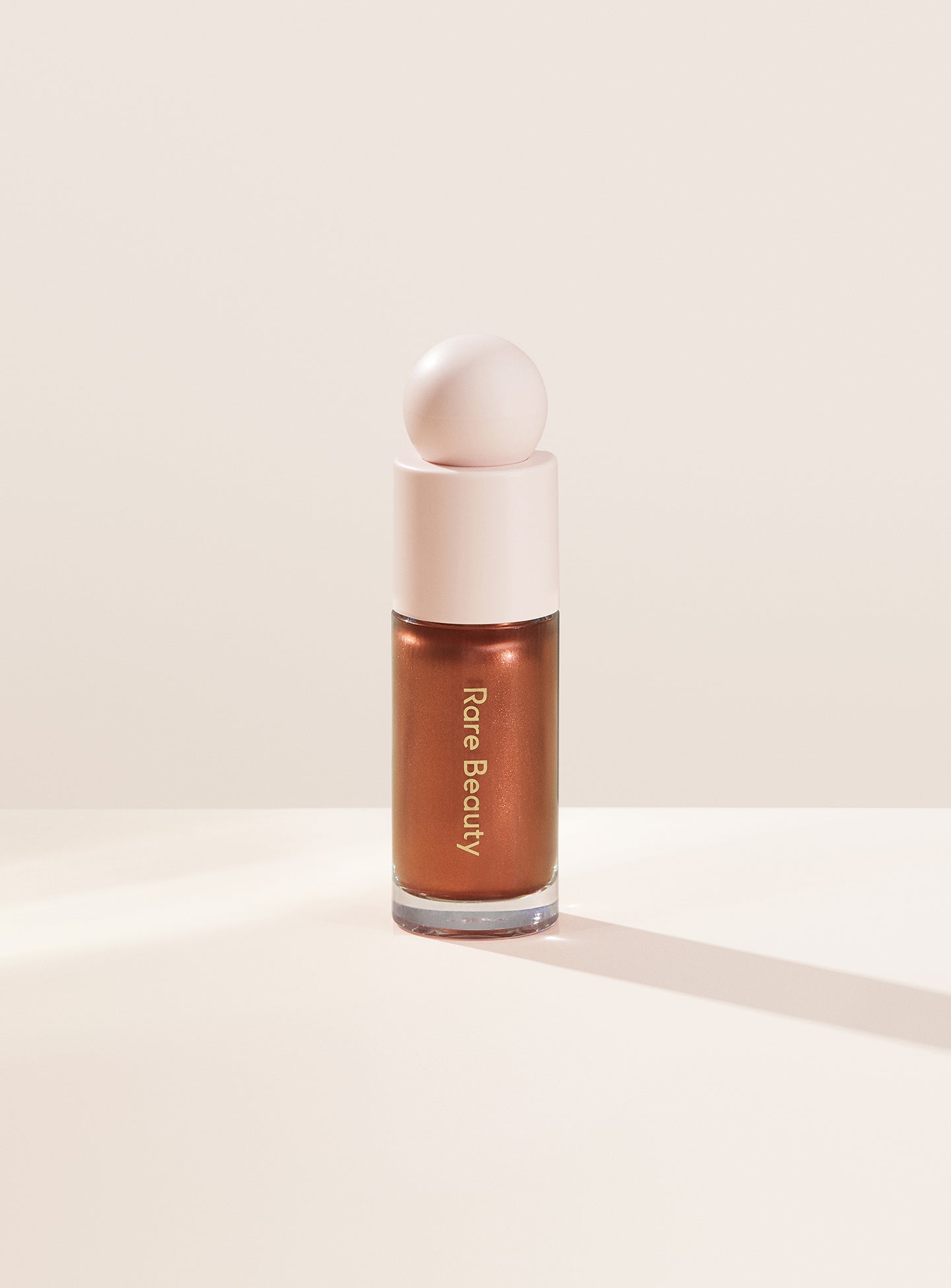 

Жидкий люминайзер Positive Light Rare Beauty, цвет reflect/deep bronze, 15 мл