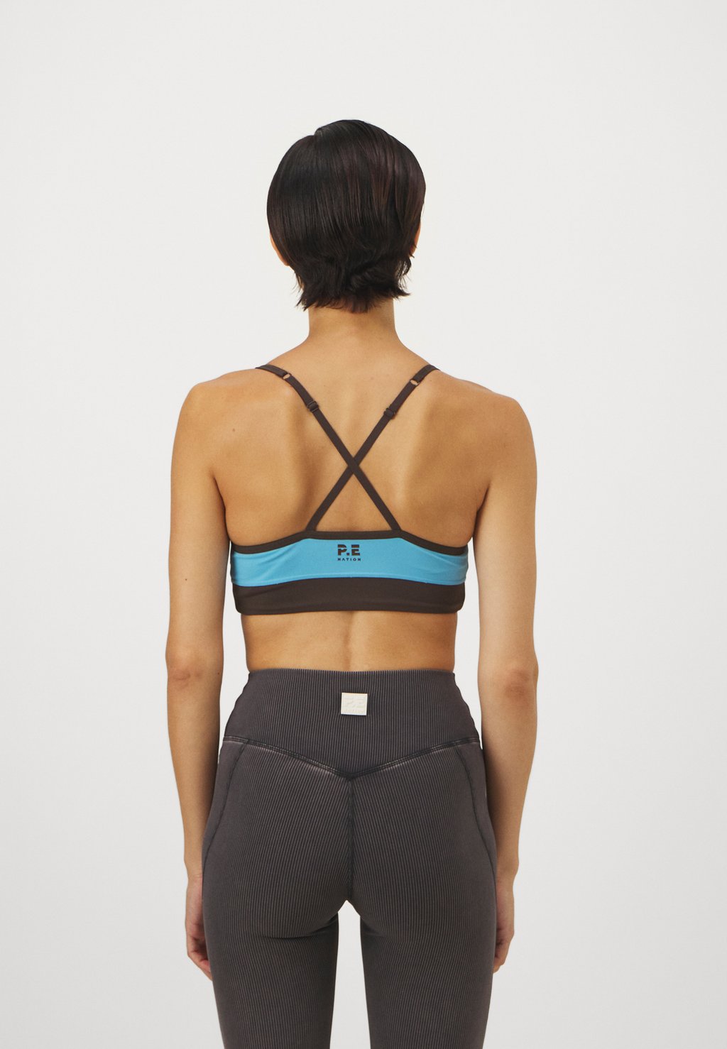 

Спортивный бюстгальтер средней поддержки OVERLAND 2 BRA P.E Nation, светло-голубой