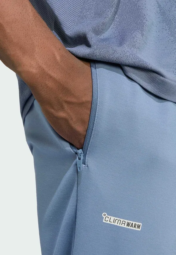 Теплые брюки из технологичной одежды - спортивные штаны Adidas Performance, чернильный — фото 4