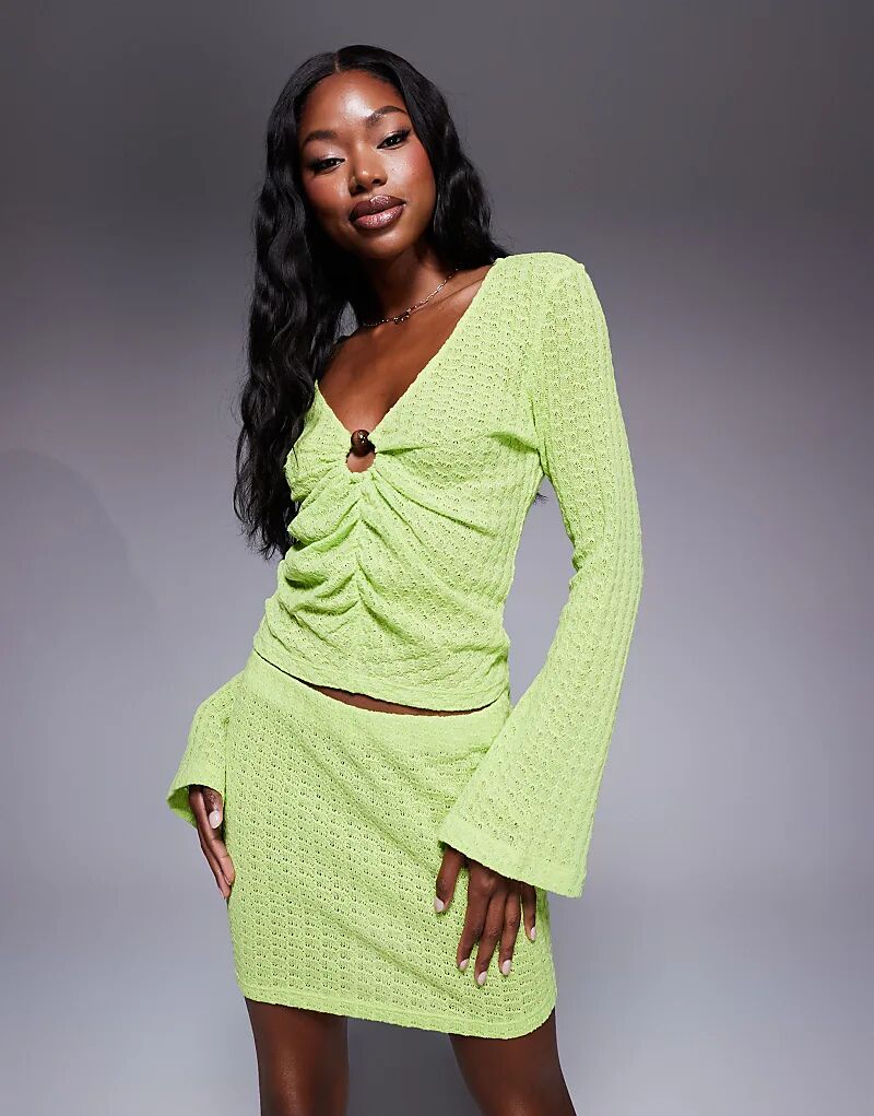 

Трикотажный топ с длинными рукавами и фурнитурой зеленого цвета от ASOS DESIGN