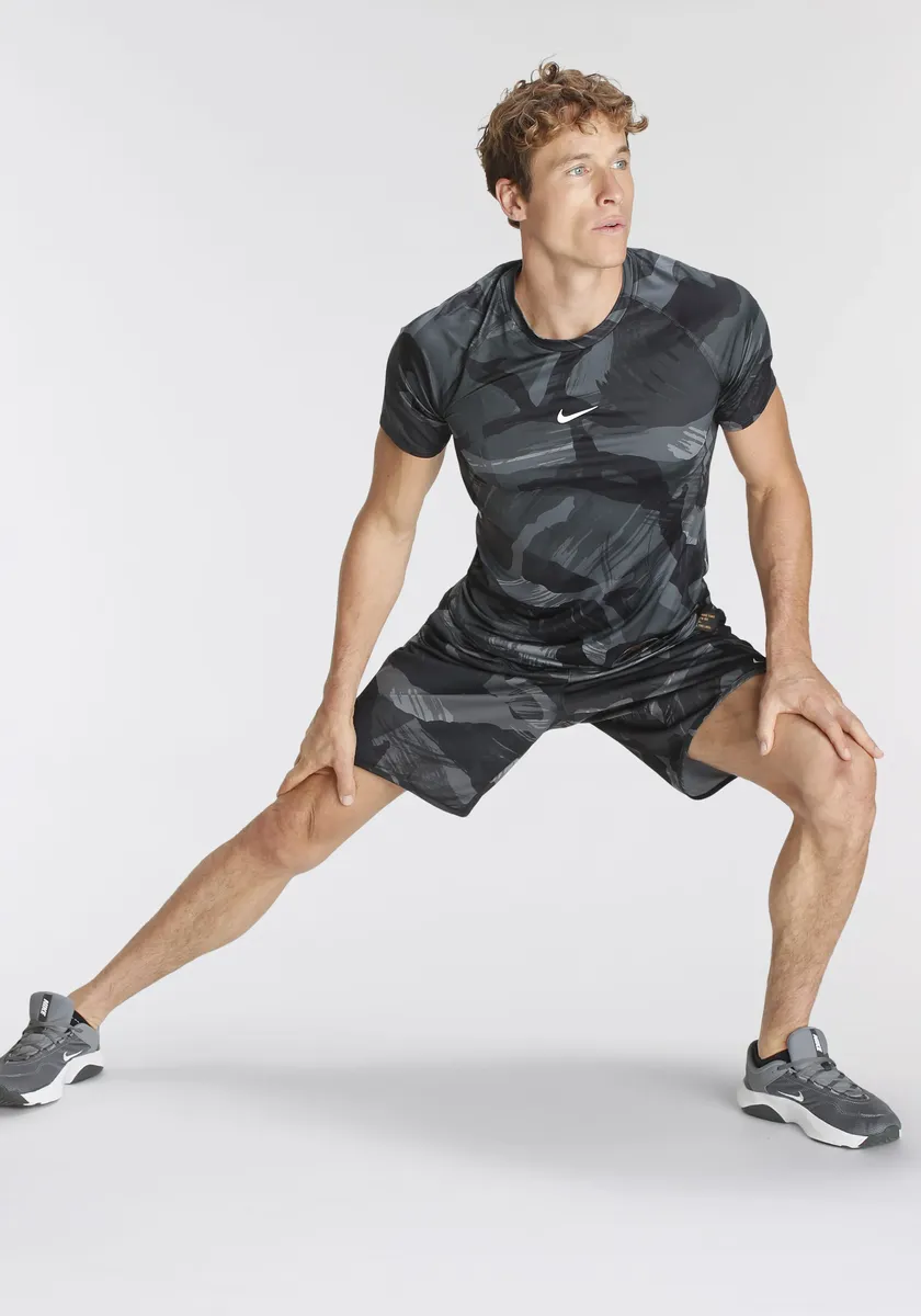 

Тренировочная рубашка Nike "PRO DRI-FIT MEN'S SHORT-SLEEVE SLIM CAMO TOP", цвет Black/Coconut Milk