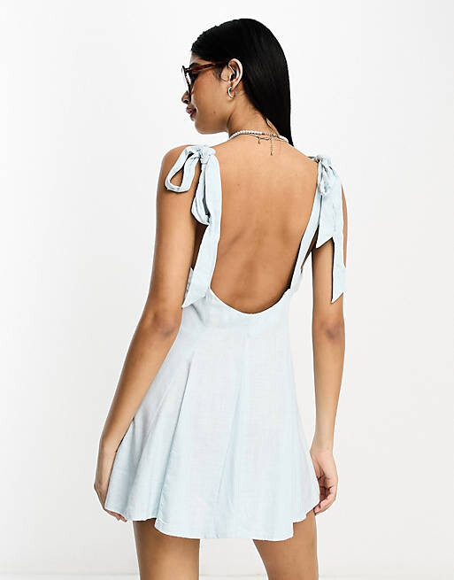 

Синий льняной сарафан мини с перекрестными бретелями и годетами ASOS DESIGN