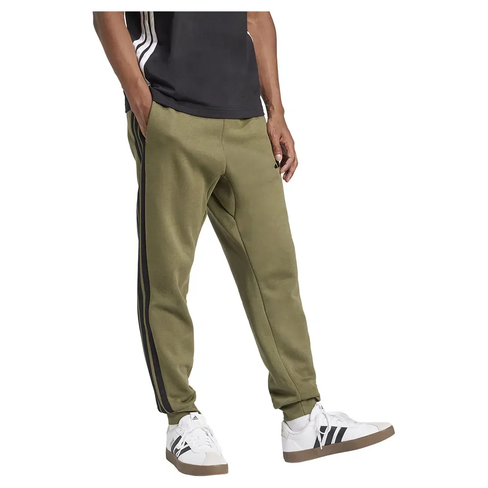 Брюки флисовые с лампасами Adidas Essentials 3 Stripes Fleece joggers, зеленый — фото 4