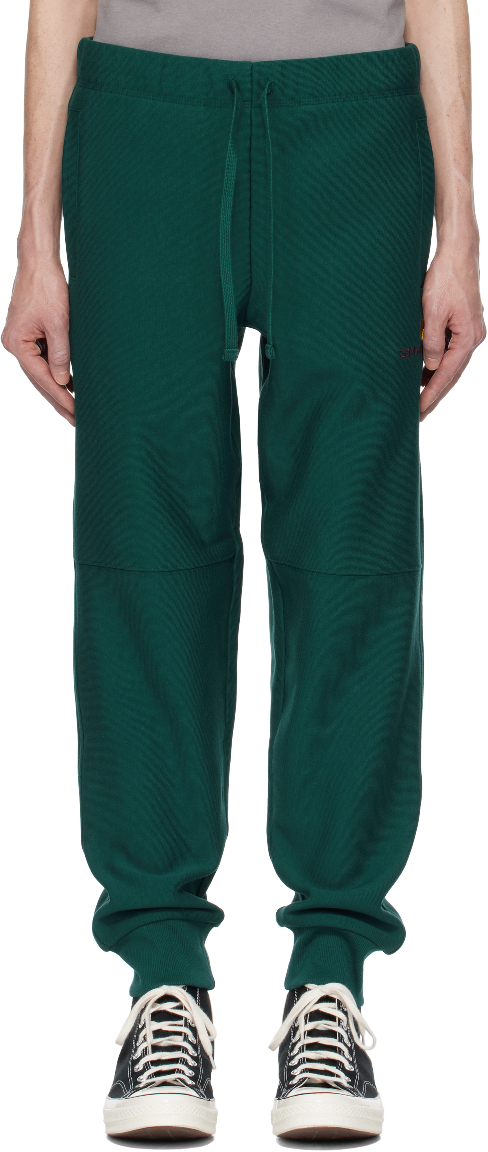 

Зеленые спортивные штаны с надписью American Script Carhartt Work In Progress