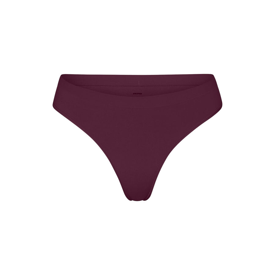

Стринги SKIMS Soft Smoothing Seamless, цвет Deep Berry