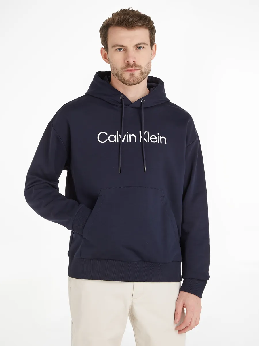 

Толстовка Calvin Klein с капюшоном "HERO LOGO COMFORT HOODIE" и надписью-логотипом, цвет Night Sky