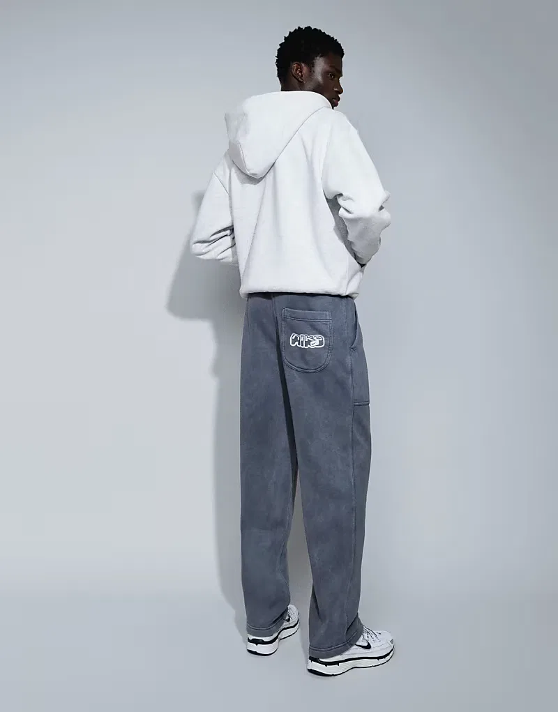 Спортивные брюки Nike с графическим рисунком и открытым низом, выцветшего, черный — фото 4