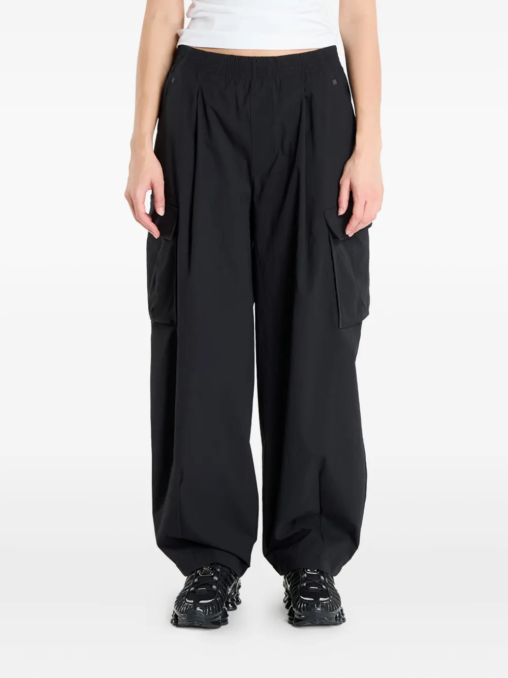 

Брюки UA Unstoppable с накладными карманами Under Armour, черный