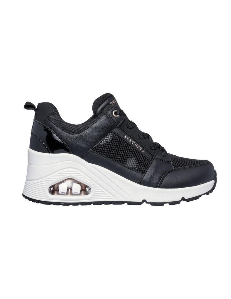 Женские кроссовки Skechers Uno на танкетке черного цвета.