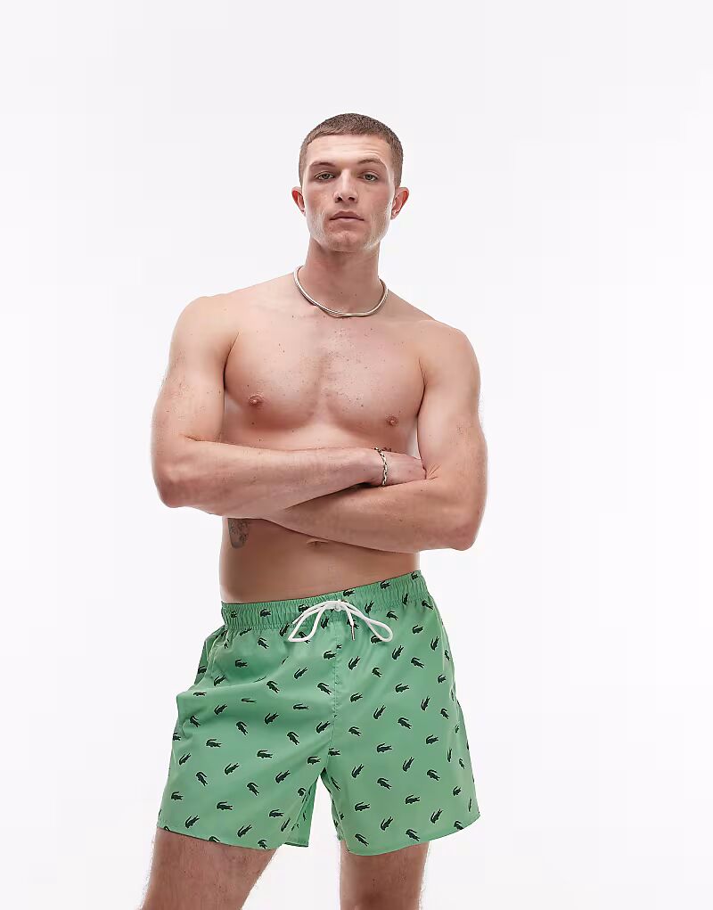 

Плавки Lacoste зеленого цвета с крокодиловым принтом по всей поверхности