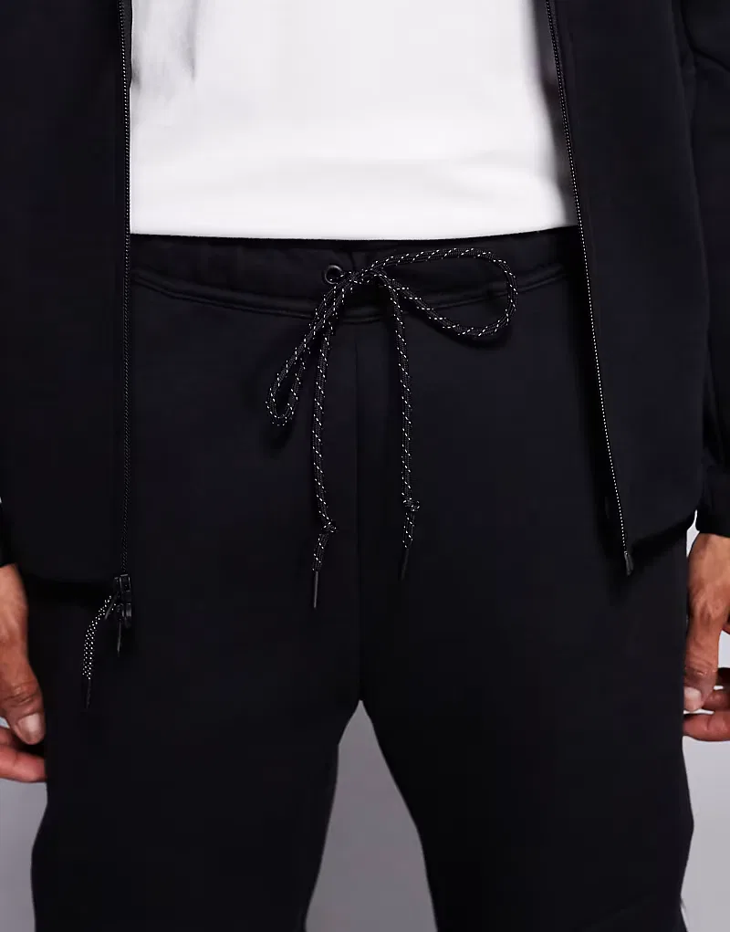 Светоотражающие спортивные штаны Nike Tech Fleece, черный — фото 4