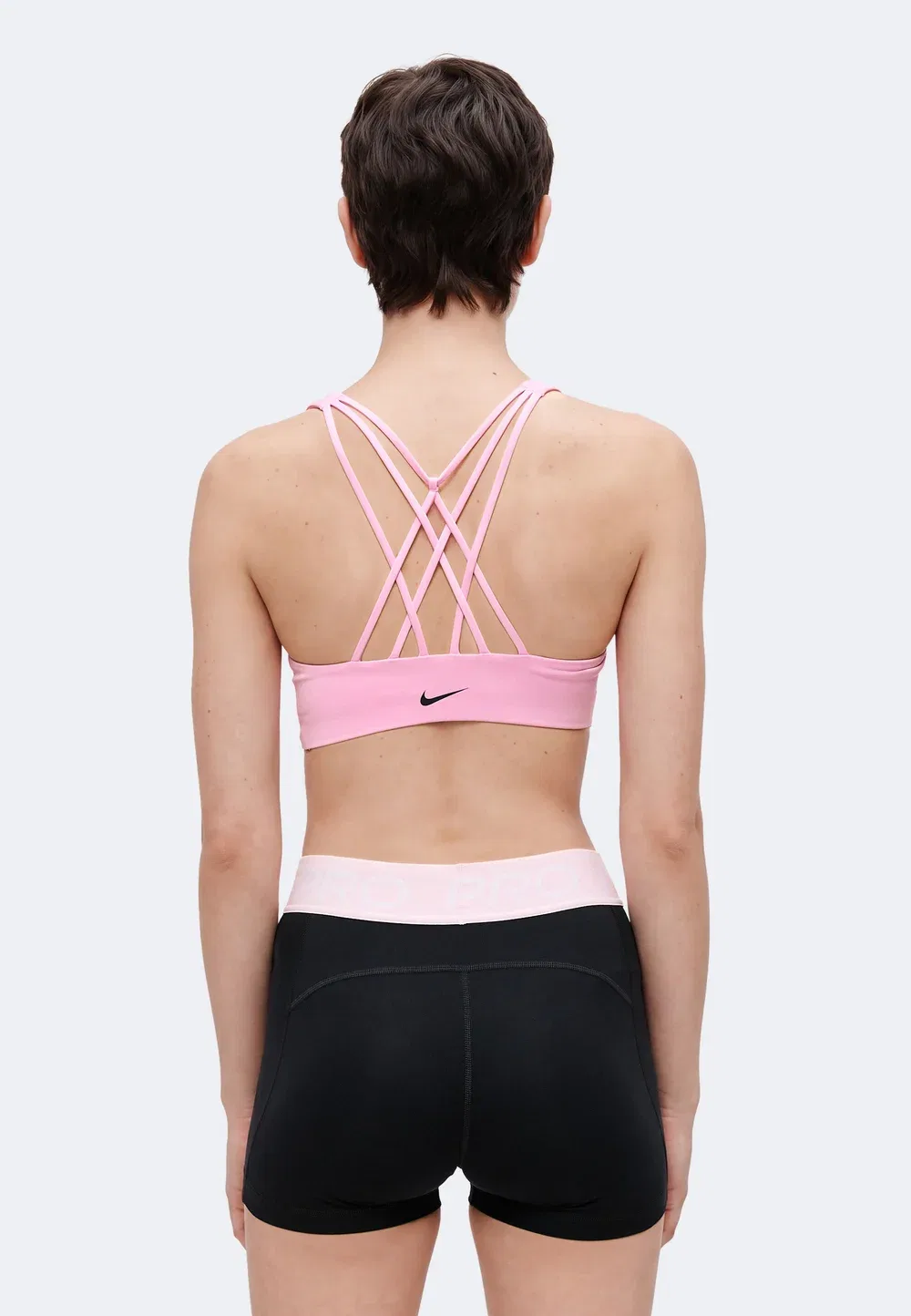 W nk df indy strappy bra - спортивный бюстгальтер со средней поддержкой Nike Performance, Pink Rise/Black — фото 3