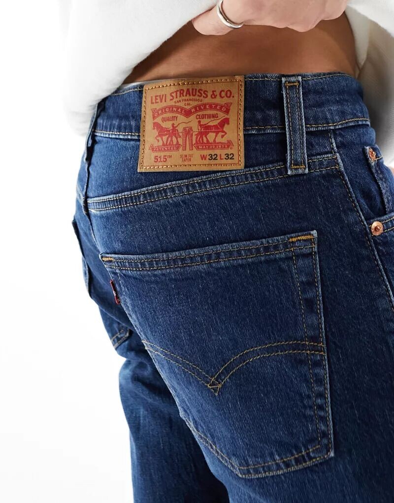 Джинсы узкого кроя Levi's 515 темно-синего цвета — фото 2