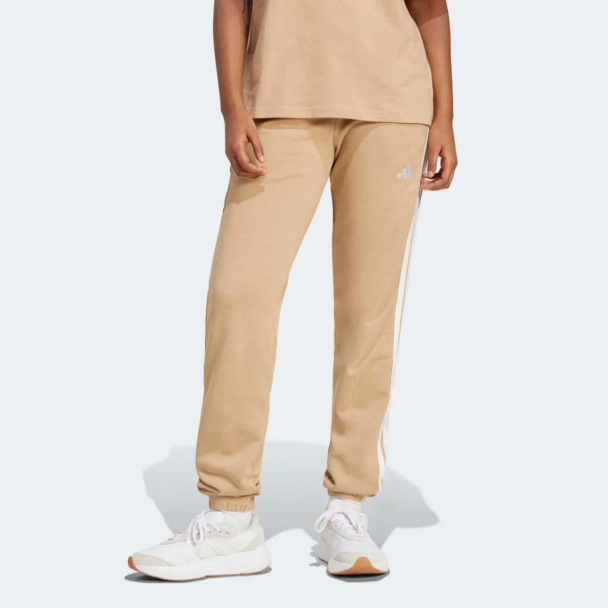 

Женские брюки Essentials French Terry с манжетами и 3 полосками adidas, коричневый