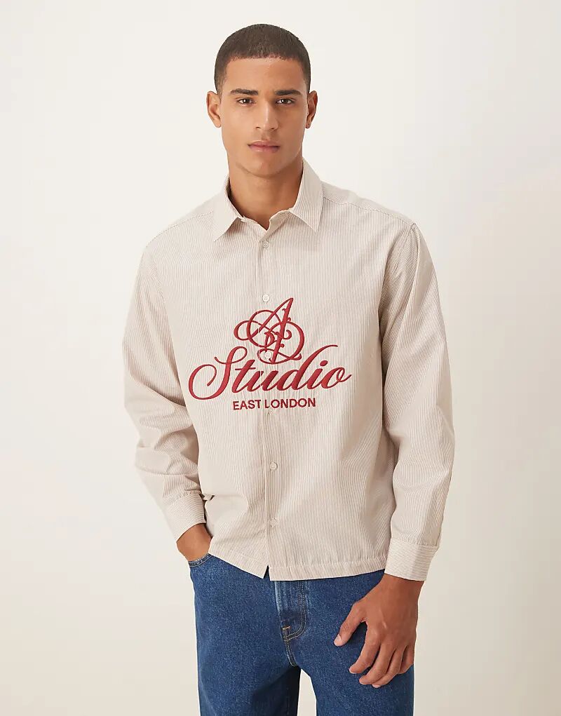 

Рубашка свободного кроя ASOS DESIGN с принтом на груди белого цвета