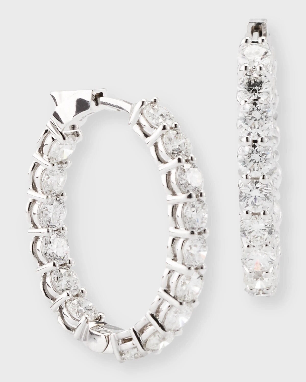 

Овальные серьги-кольца из белого золота 18 карат, вес 6,15 тонны Neiman Marcus