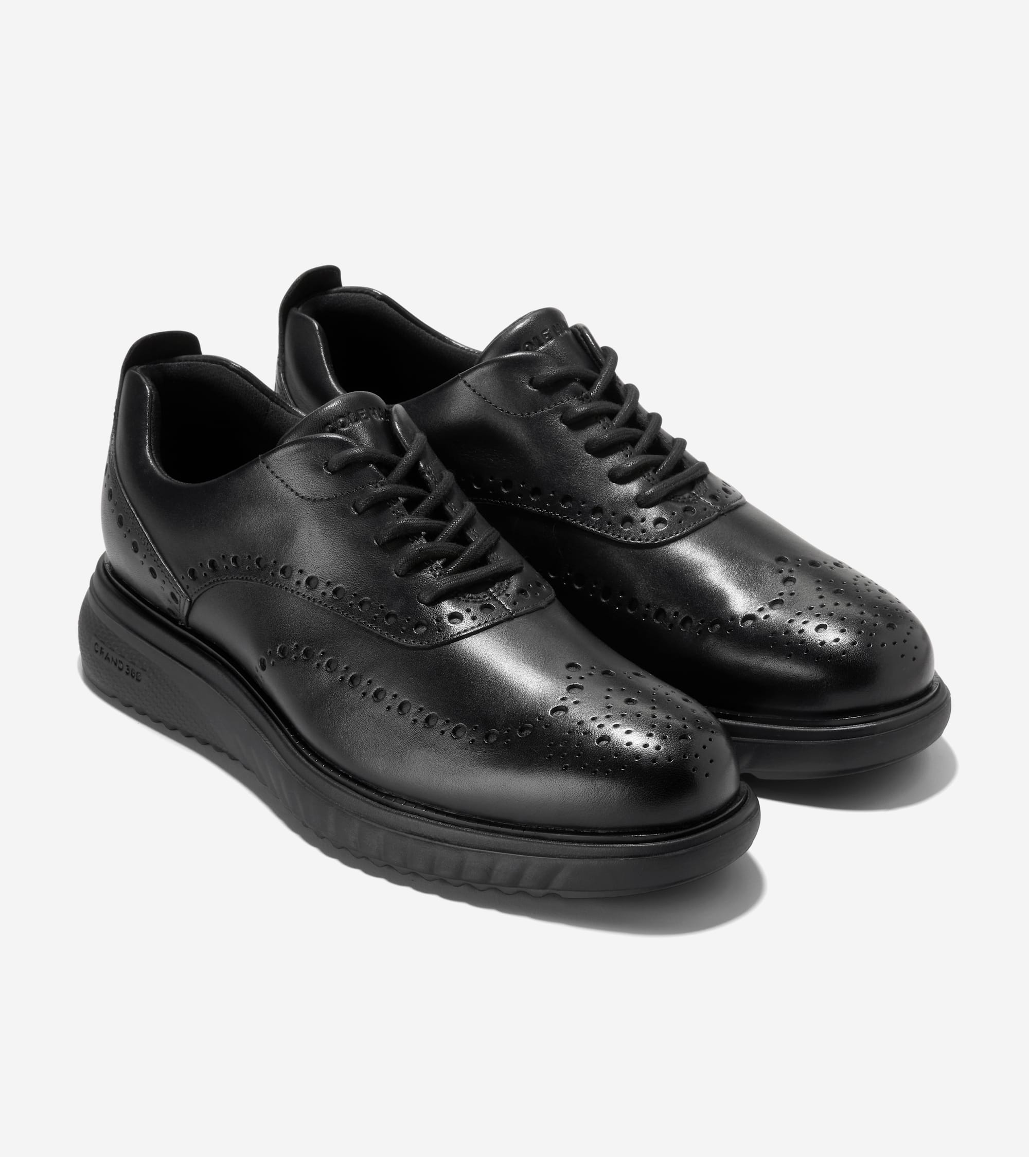 

Cole Haan Мужские оксфорды Zerogrand Eon Wingtip, черный
