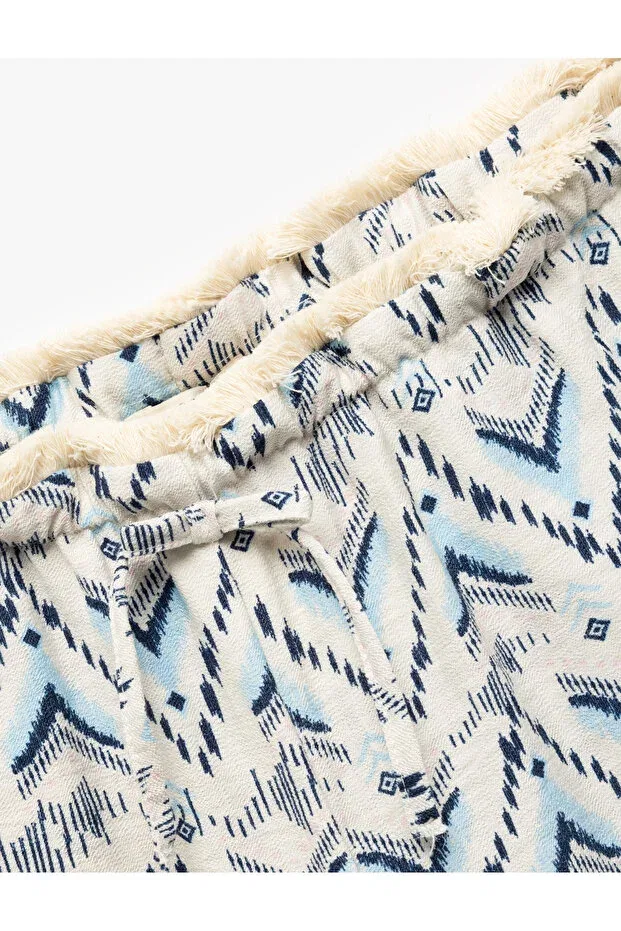 Детские брюки для девочек с принтом Viscose laced waist patterned straight leg trousers Koton, Blue Patterned — фото 3