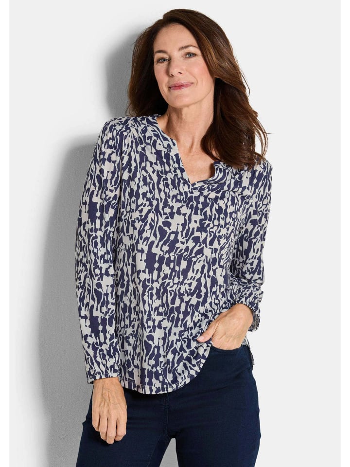 

Блузка из джерси. Элегантная блузка-рубашка с V-образным вырезом синего цвета с рисунком. GOLDNER