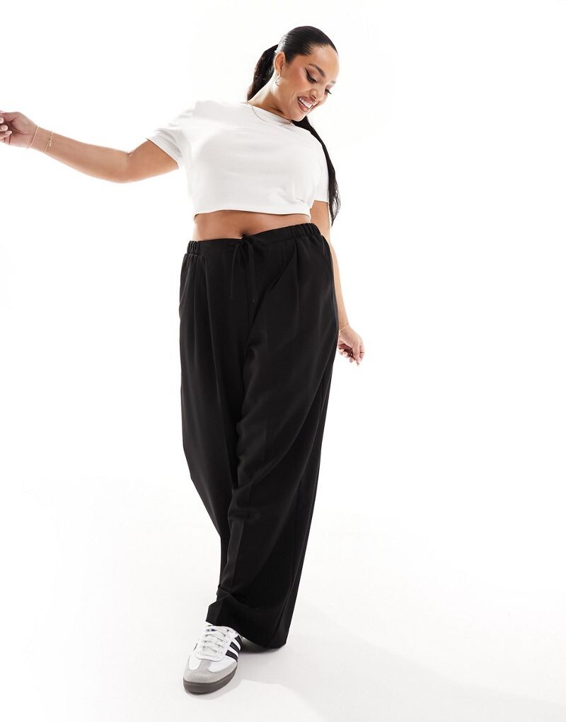 

Черные брюки приталенного кроя с застежкой ASOS DESIGN Curve