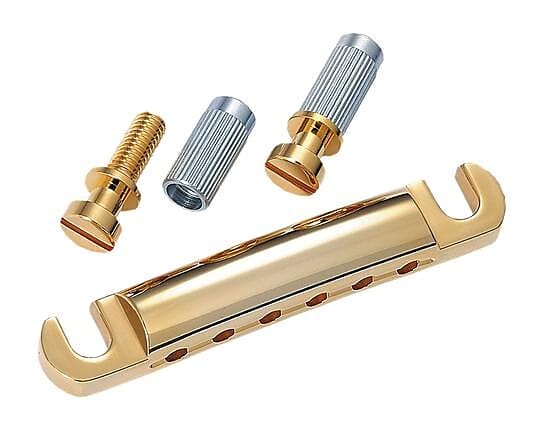 

Allparts Gold Stop Tailpiece, со шпильками и анкерами с резьбой США, золото, расстояние между шпильками 3-1/4 дюйма TP-0400-002