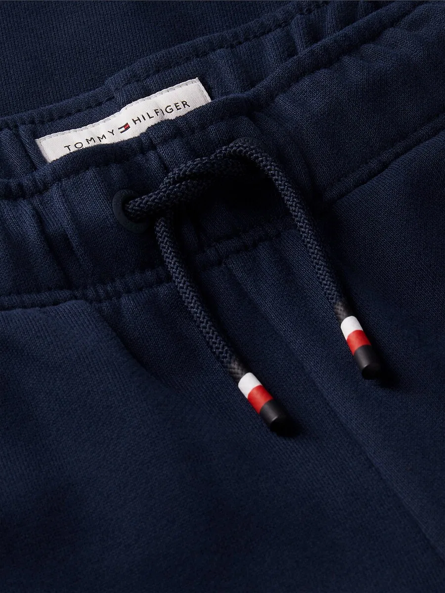 Зауженные брюки TOMMY HILFIGER 'Brand Love' в цвете Night Blue — фото 4