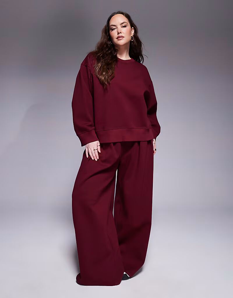 

Брюки интерлок Curve ASOS DESIGN очень широкие, бордового цвета.