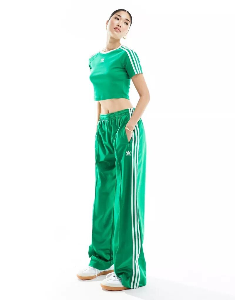 

Зеленые спортивные брюки adidas Originals Firebird