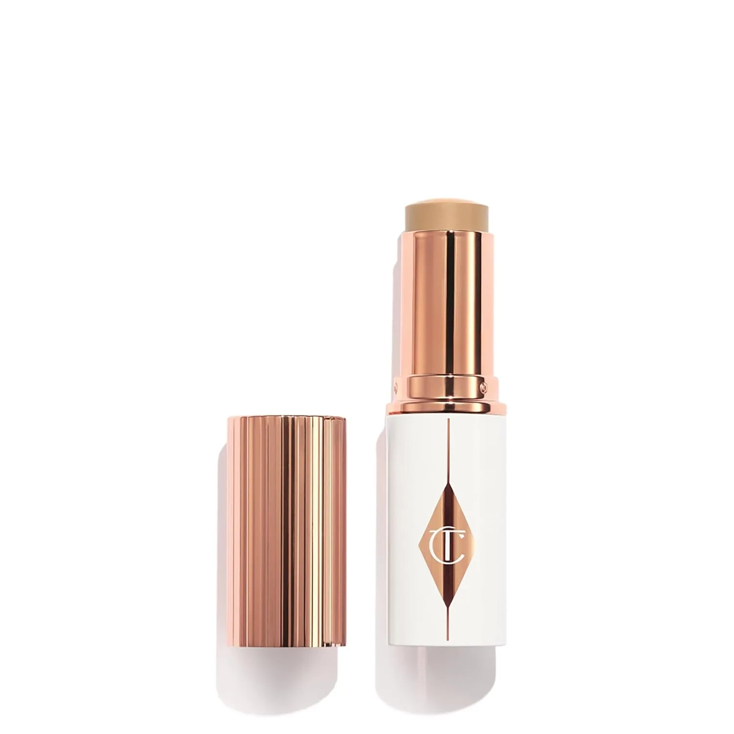 Charlotte Tilbury Unreal Skin Tint & Sheer Glow Hydrating Foundation Stick - кремовая тональная основа с легким покрытием и увлажняющим эффектом, 05 Medium - Medium with neutral undertones
