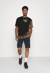 

Футболка с набивным рисунком RETRO BLEACHED TEE UNISEX Karl Kani, черный