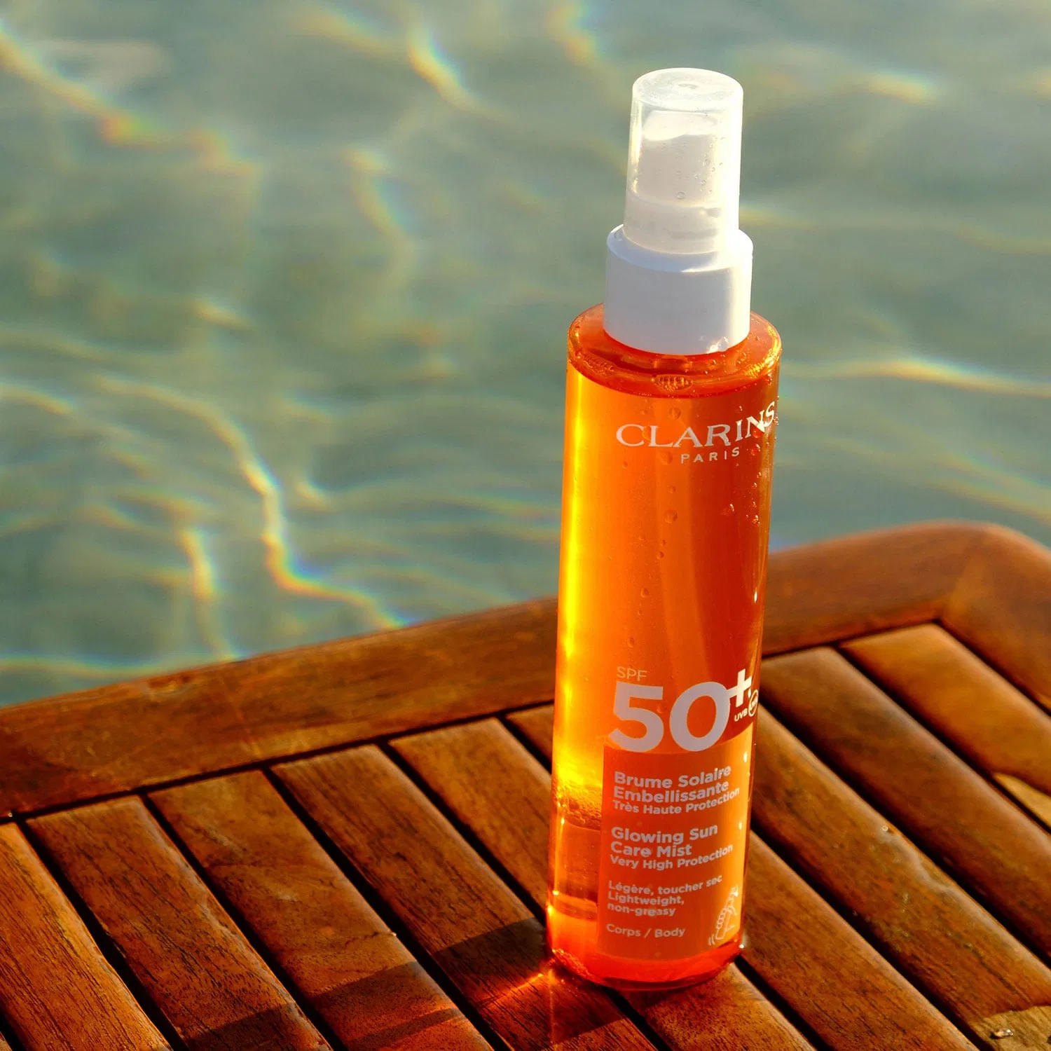 Солнцезащитный спрей для тела SPF 50+ 150 мл с экстрактом какао и витамином E, CLARINS — фото 4