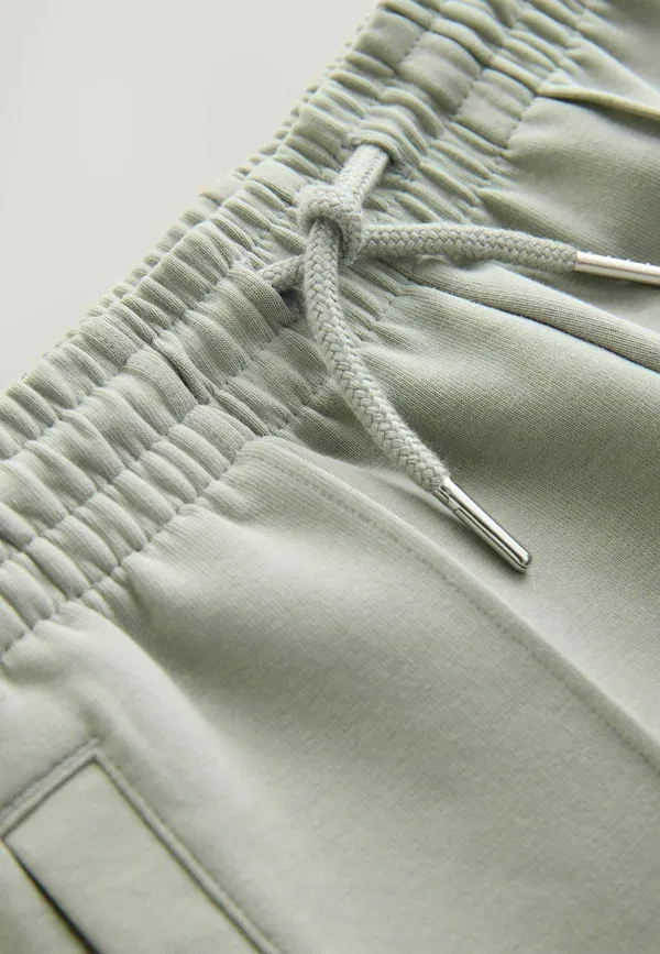 Брюки хлопковые Smart Regular Jogger Next, Soft Green Interlock, зеленый — фото 2