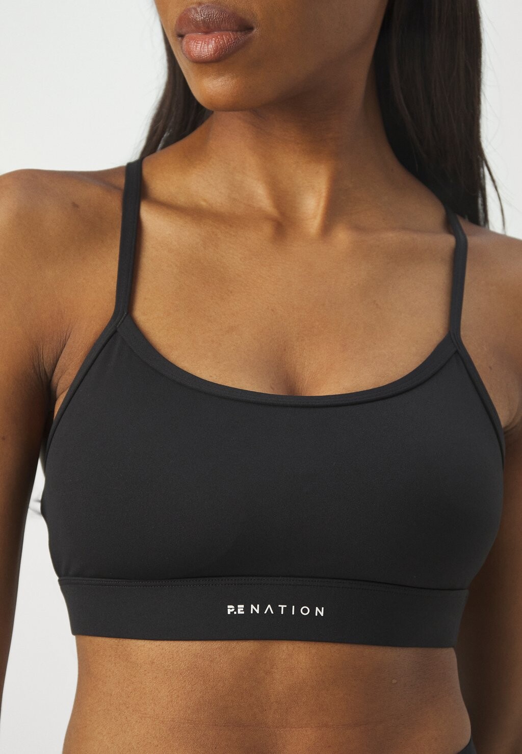 

Спортивный бюстгальтер средней поддержки SIGNATURE BRA PE Nation, черный