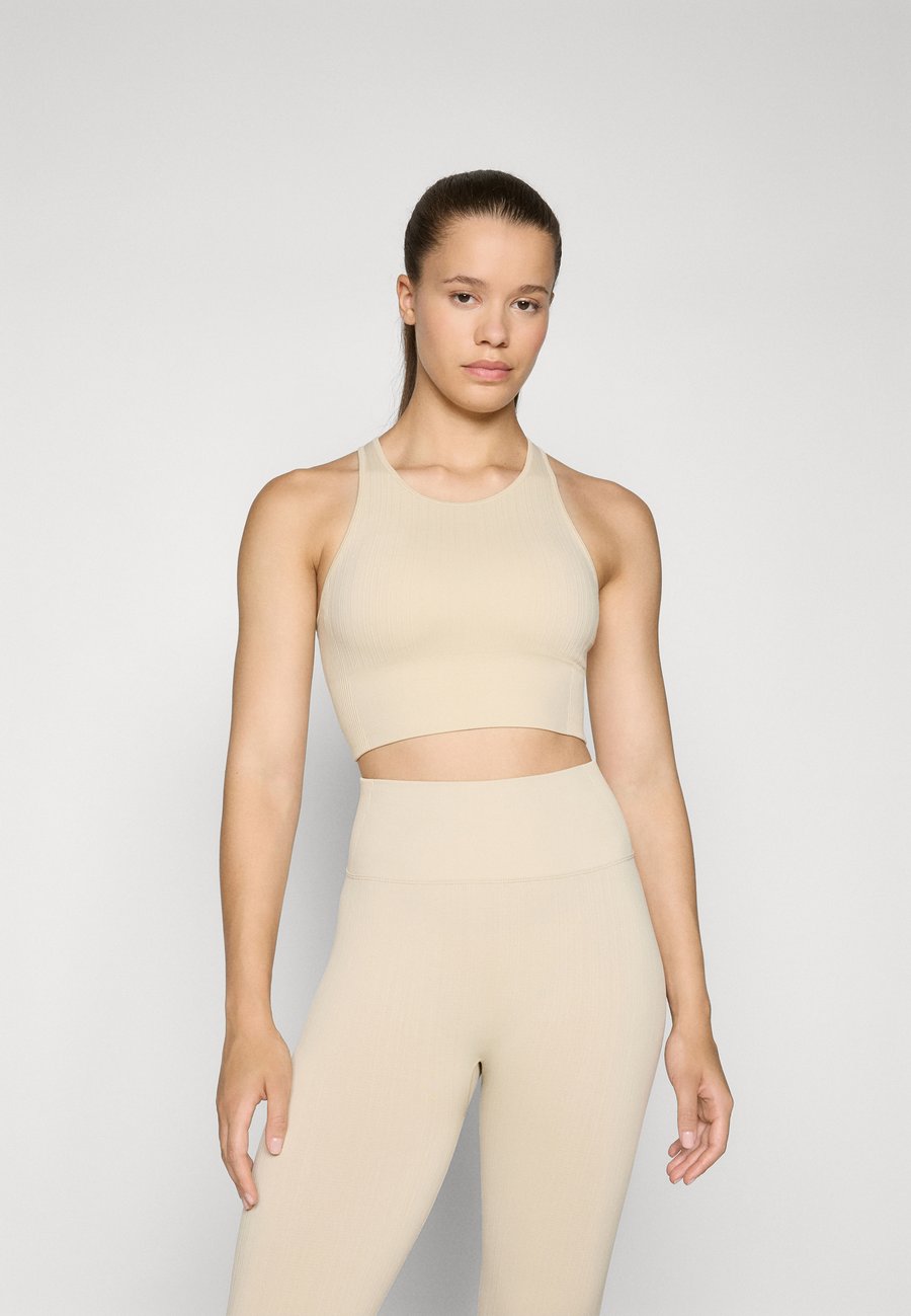 

Топ Casall SEAMLESS PADDED SPORTS, Ecru/Beige