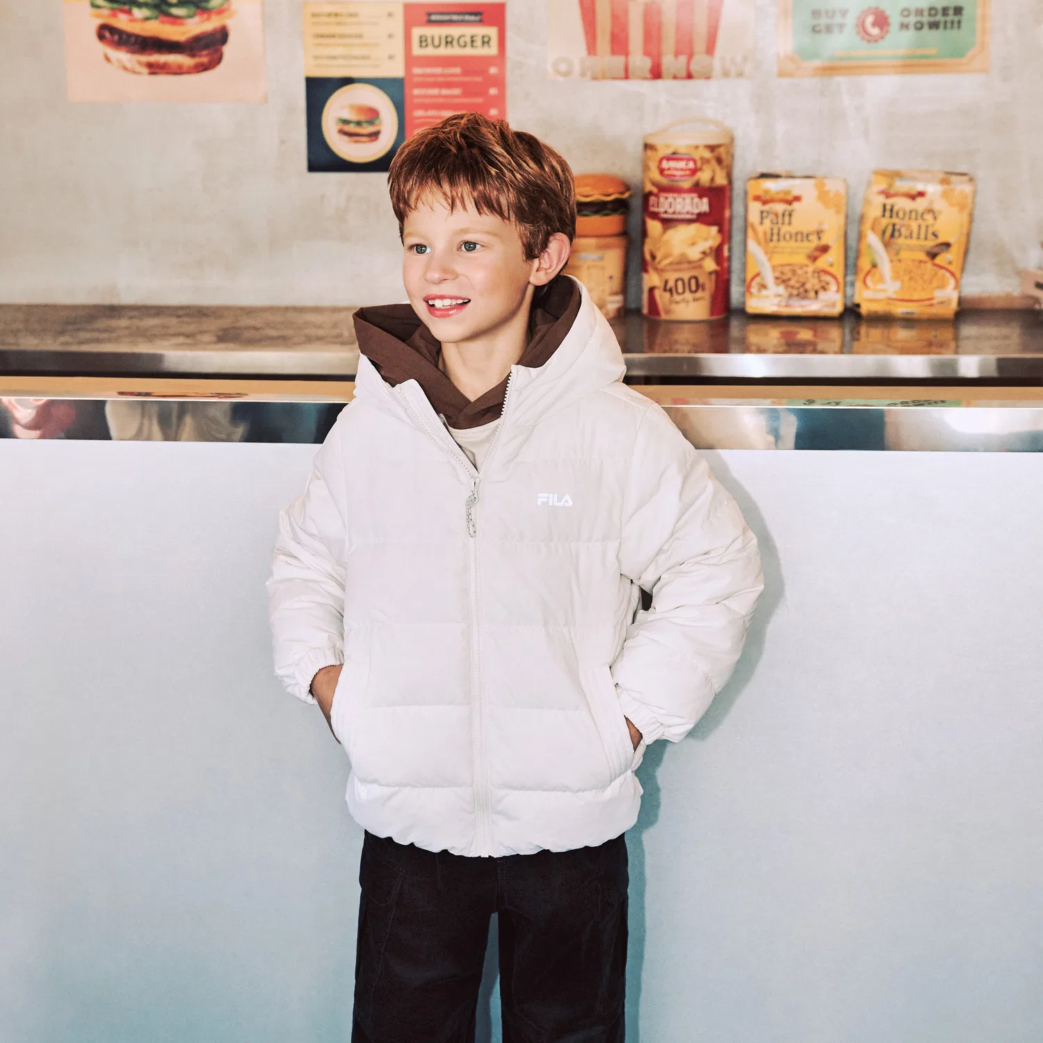 Детский лёгкий пуховик с капюшоном айвори от Fila Kids