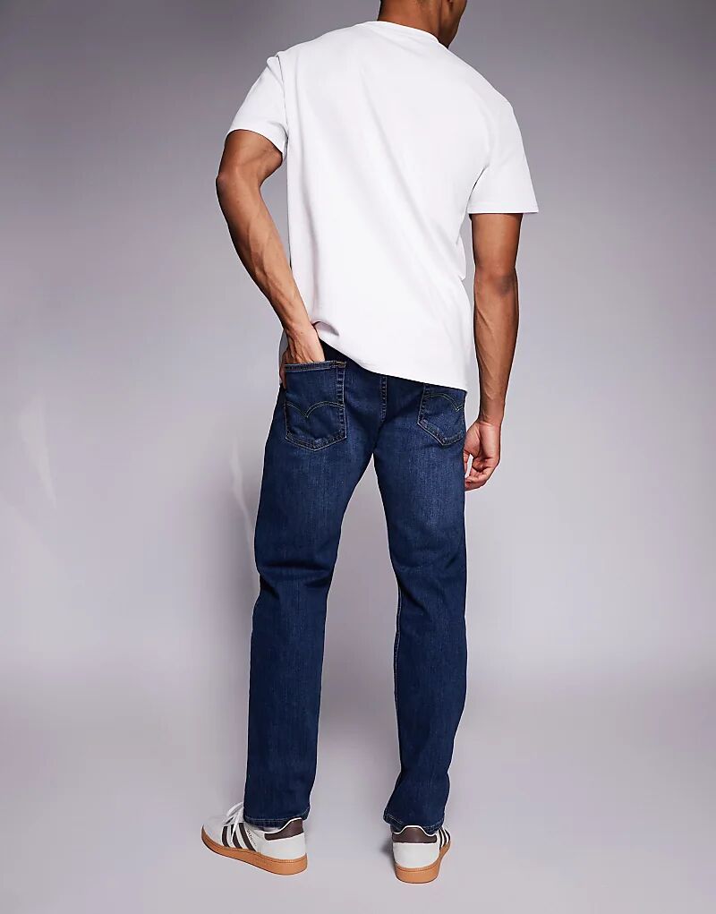 Зауженные джинсы Levi's 502 средне-синего цвета — фото 3