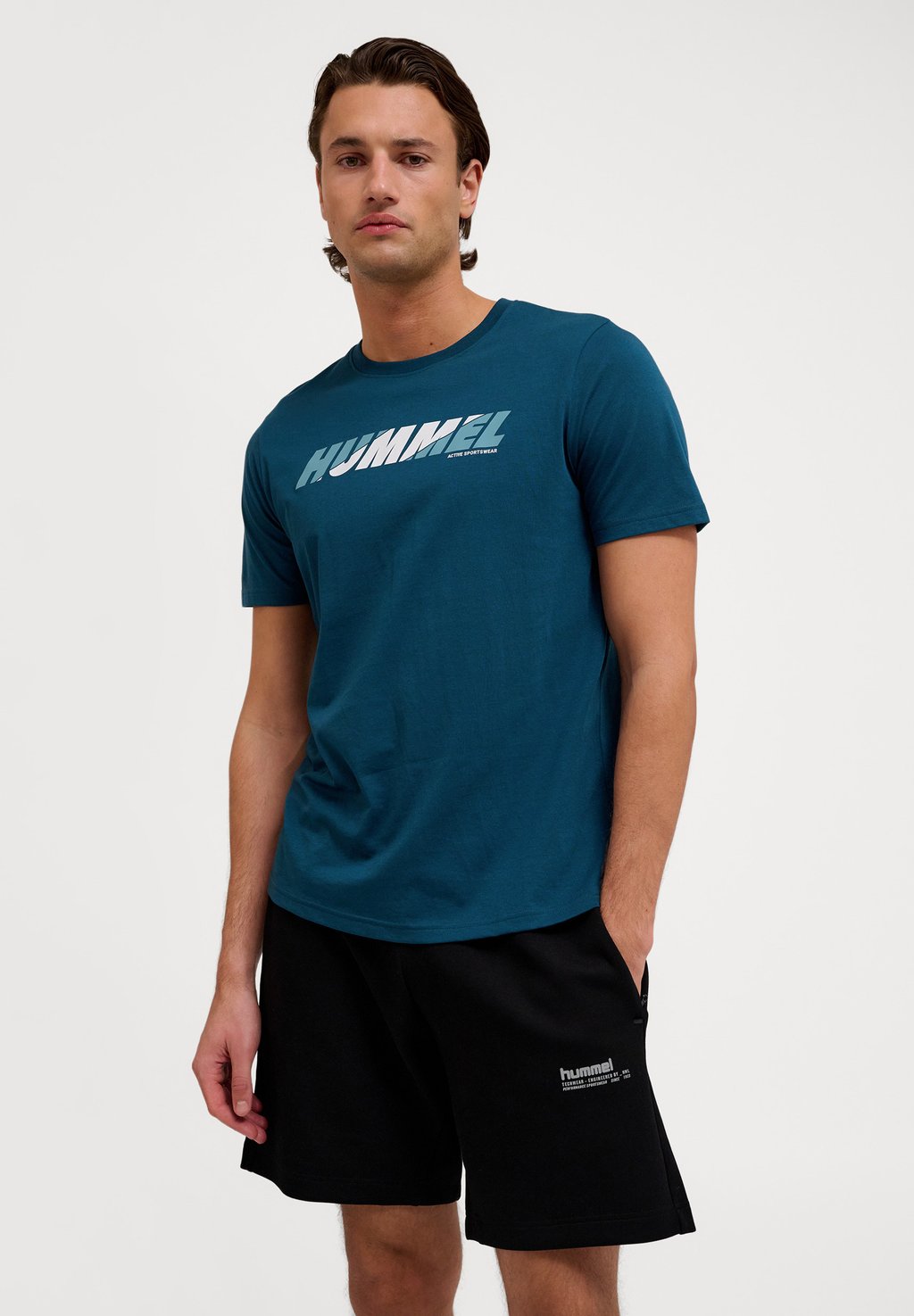 

Футболка с принтом GRAPHIC BOLD LOGO TEE Hummel, темно-зеленый
