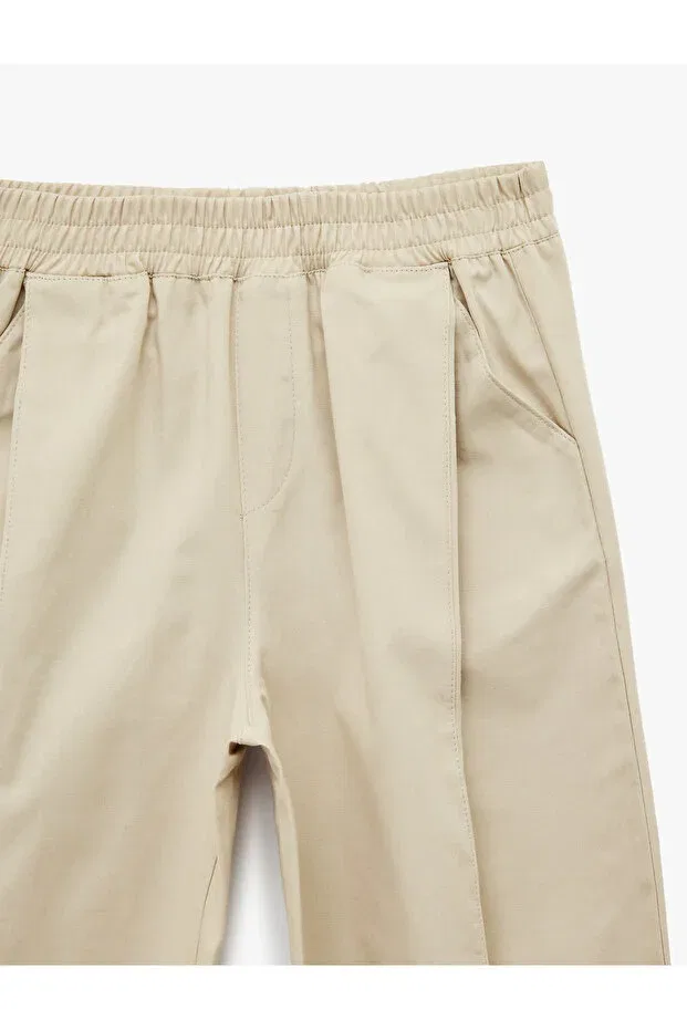 Детские брюки для девочек свободного кроя Elastic waist oversize balloon cut trousers Koton, Beige — фото 3