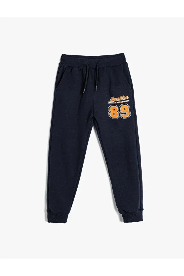 Детские спортивные штаны для мальчиков с принтом Jogger sweatpants with tie waist and sporty print detail Koton, Navy Blue