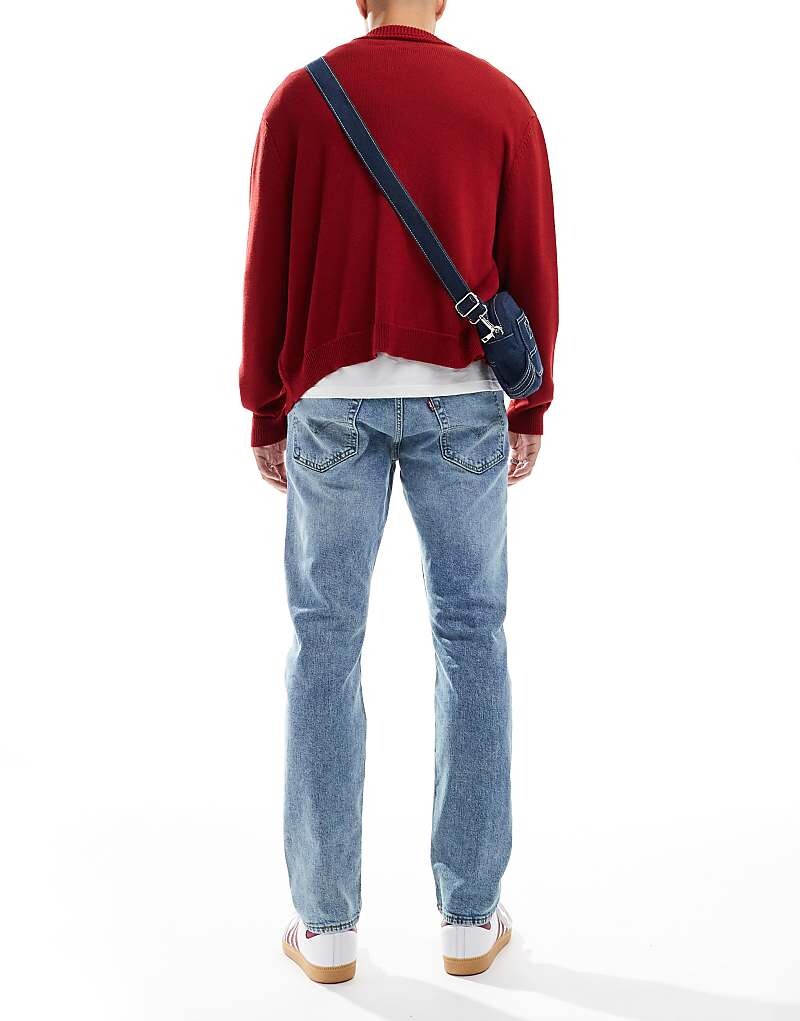 

Голубые зауженные джинсы Levi's 502