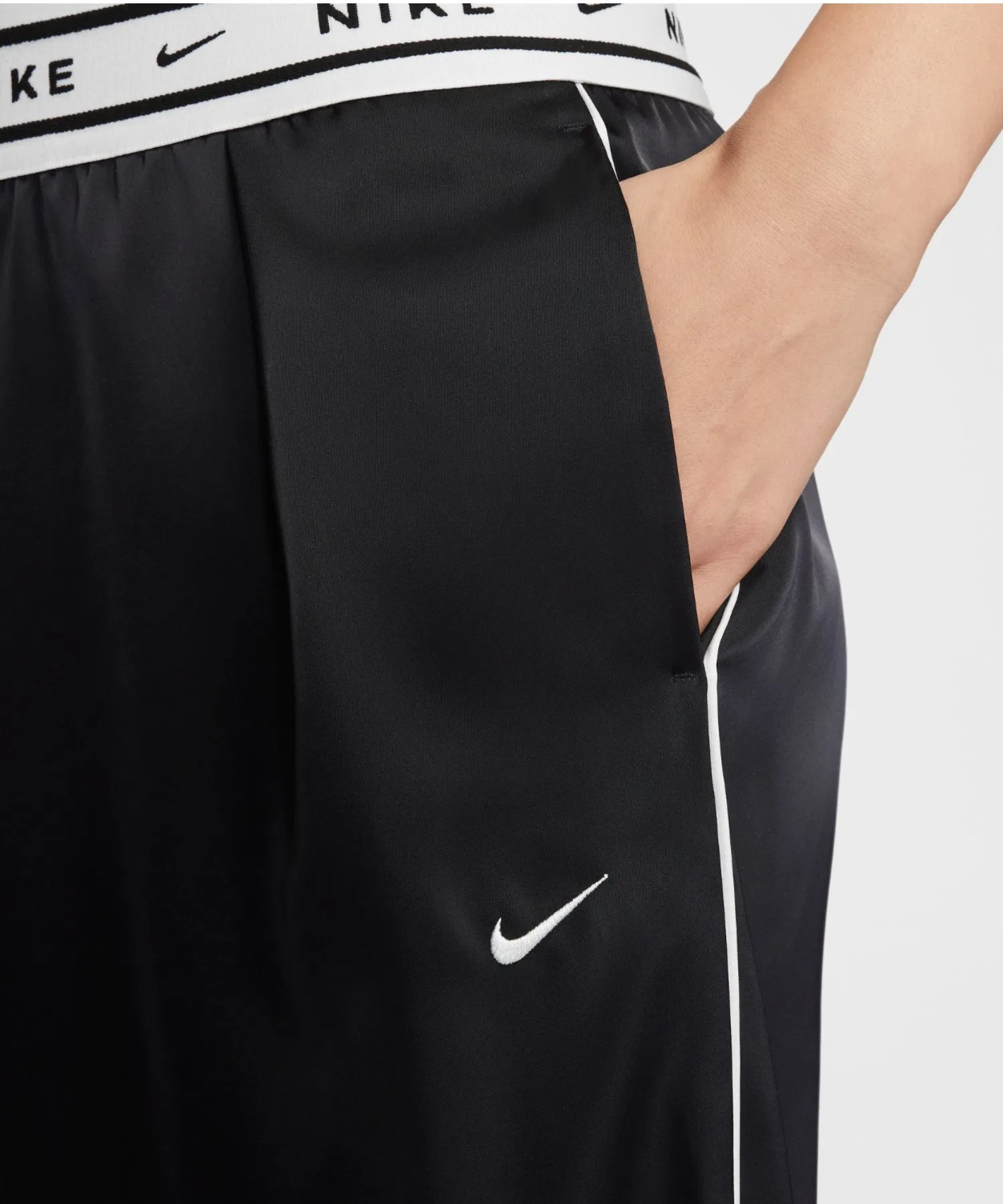Женские спортивные брюки NIKE OFFLN WVN STN зелёные — фото 3