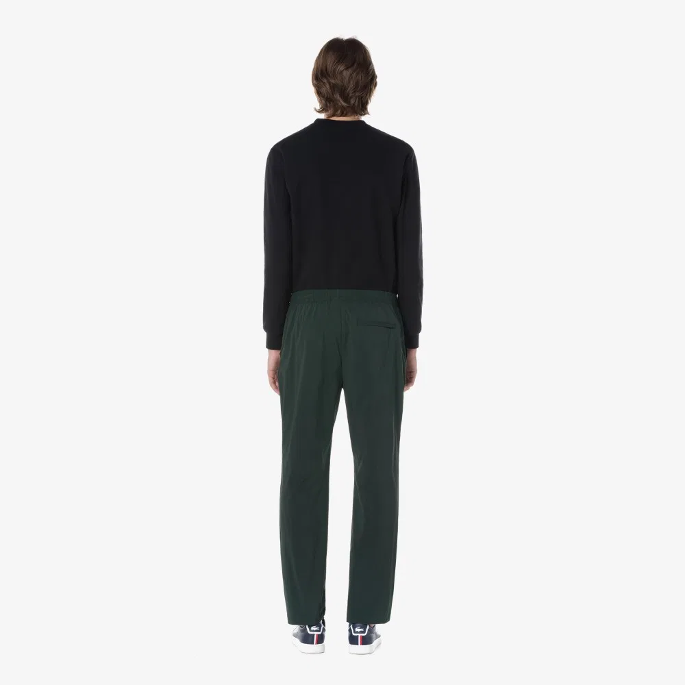Мужские тканые базовые брюки глубокого зелёного цвета от Lacoste — фото 4