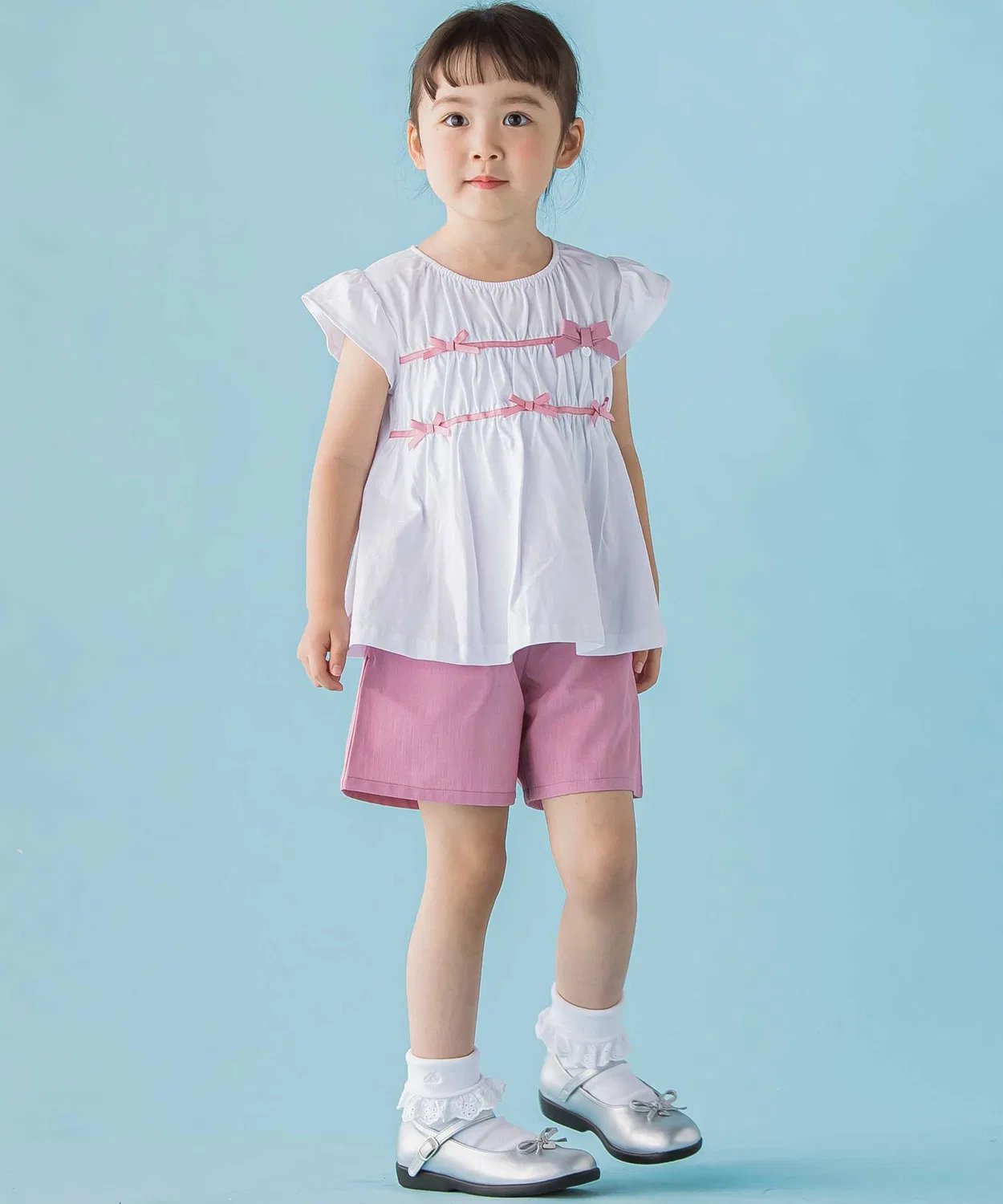 Детский комплект: топ с рюшами и бантом + юбка-шорты, BeBe Petits Pois Vert, 95-150 см, розовый — фото 2