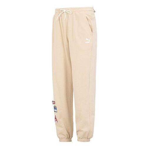 

Брюки team badge sweatpants 'beige' Puma, бежевый