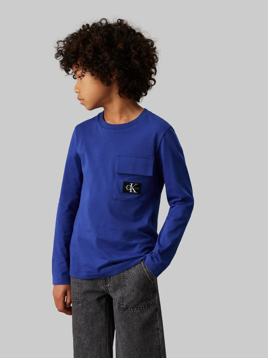 

Рубашка с длинными рукавами Calvin Klein Jeans "Badge Reg. Ls T-Shirt", для детей до 16 лет, с нашивкой-логотипом, цвет Pigment Blue