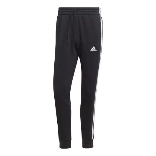 

Брюки Essentials флисовые 3 полоски зауженные манжеты джоггеры Adidas, черный
