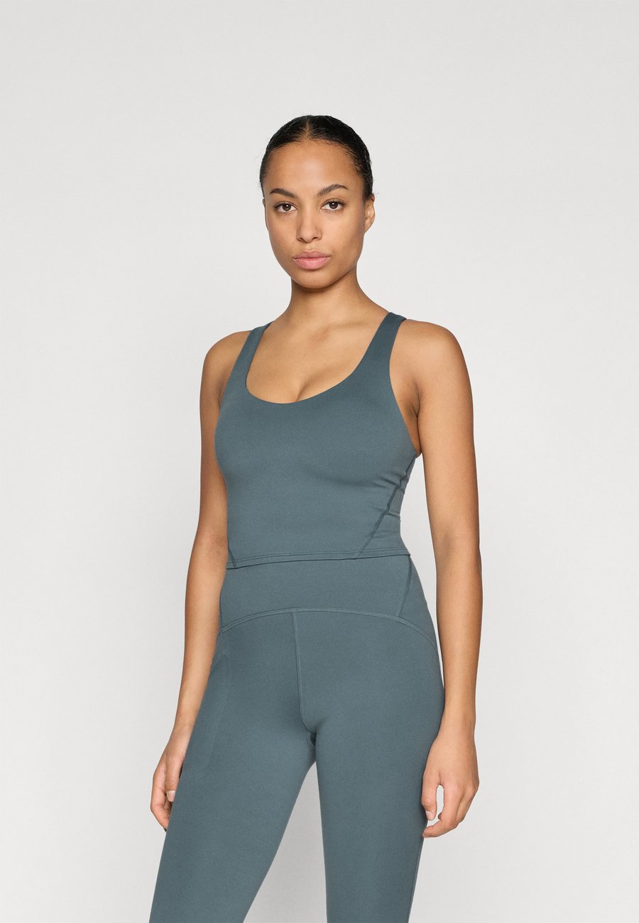 

Бюстгальтер The North Face JAIDA LONG LINE BRA, Granite Grey/Dark Grey