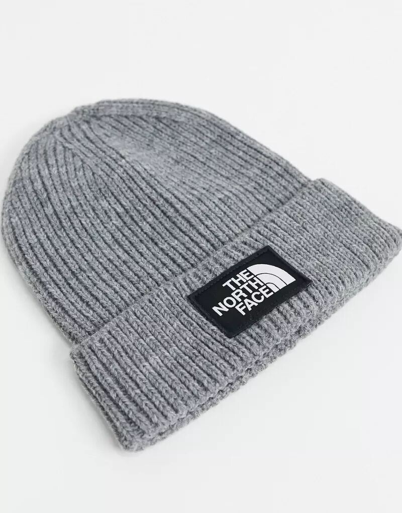 

Серая вязаная шапка The North Face с манжетой и нашивкой с логотипом