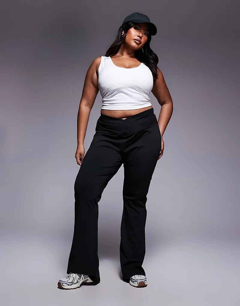 

Черные брюки-клеш с высокой талией и перекрестными карманами ASOS DESIGN Curve Asos Curve